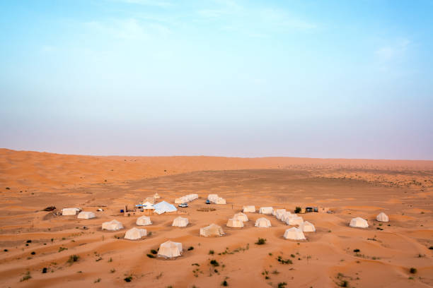 Sahara Desert Campground Campground deep in the Sahara Desert south of Douz, Tunisia tunisia sahara douz stock pictures, royalty-free photos & images