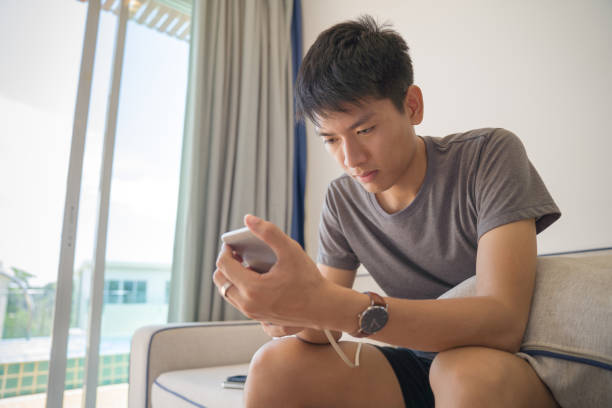 istock Young business Asian men using digital tablet and smart phone do their work at home and relax with online shopping in his vocations 1150851923