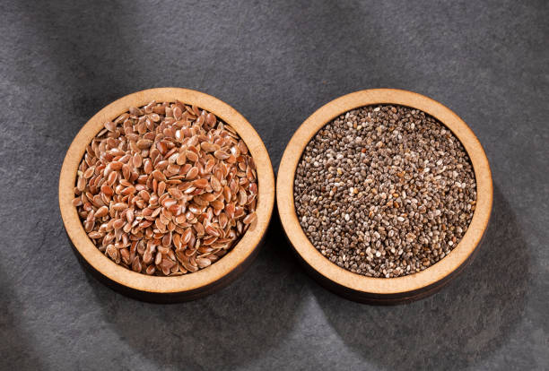 Organic chia and linseed seeds Organic chia and linseed seeds salvia hispanica plant stock pictures, royalty-free photos & images
