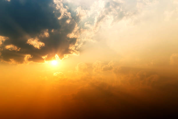 istock Orange sunrise over clouds with bright yellow sun 1150856386