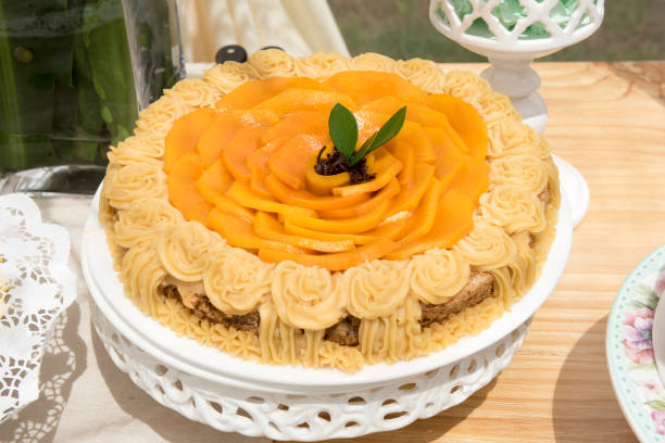 istock Delicious finely decorated carrot cake on a wooden table. 1150856539