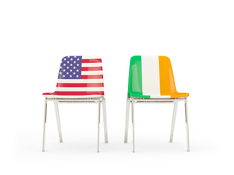 Two chairs with flags of United States and ireland isolated on white. Communication/dialog concept. 3D illustration