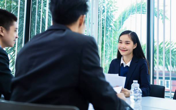 istock asian businesspeople discussing documents and ideas at meeting 1150865054