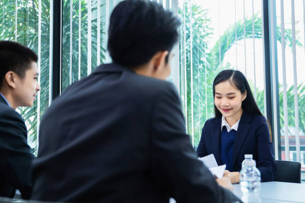 istock asian businesspeople discussing documents and ideas at meeting 1150865120