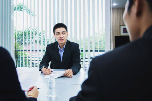 istock asian businessman discussing documents and ideas at meeting 1150865136