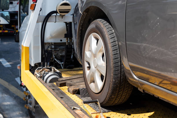 istock Broken car on flatbed tow truck being transported for repair 1150865260