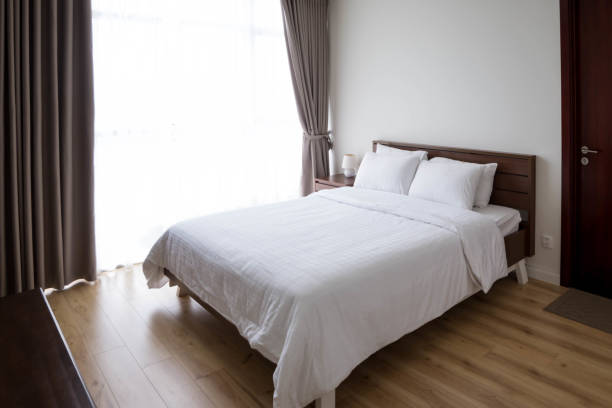 istock Hotel room bed. Booking a room for holidays concept 1150869135