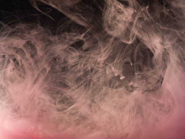 istock Pink abstract background. Close up view. Blurred background. Paint dropped into water, abstract pattern. Acrylic smoke swirling under water. Ink mixing with liquid. Background for abstract wallpaper. 1150869464