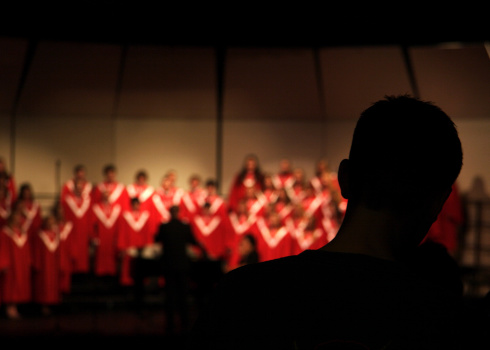 dark figure in doorway entering a concert