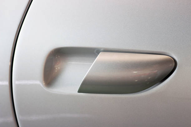 istock Handle on the car door silver color close up 1150872473