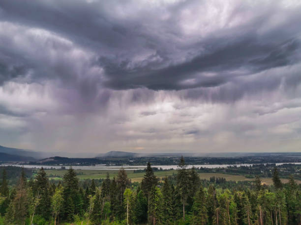 istock Cloudy Moody Stormy Sky of Storm Rain Clouds Valley River View 1150873639