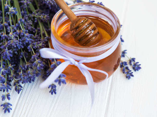 istock Jar with honey and fresh lavender flowers 1150873676