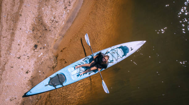 istock Kayaker paddles to shore 1150875538