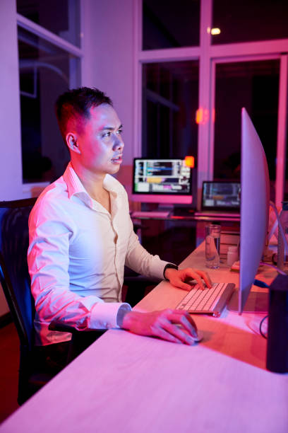 istock Businessman working at office till night 1150878746
