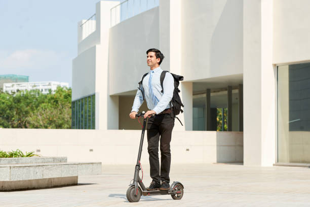 istock Businessman on scooter in the city 1150880257