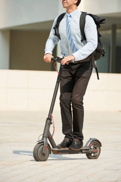 istock Businessman riding on electric scooter 1150880262