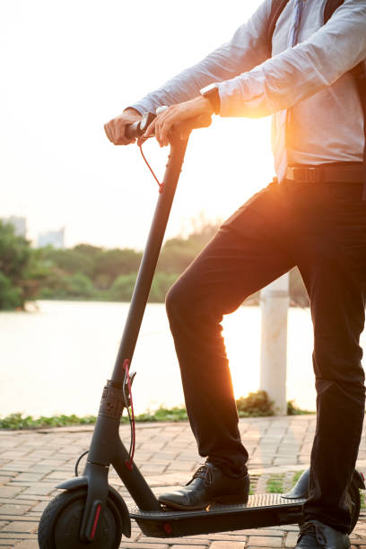 istock Man riding on scooter in the park 1150880270
