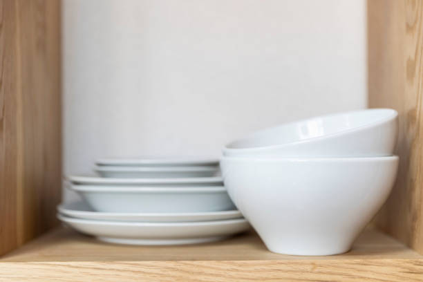 istock Cup and dish placed on the kitchen cabinet 1150881854