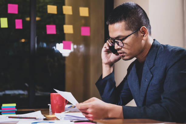 istock serious businessman calling to customer 1150882078