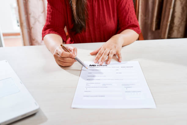 istock Woman signing a business contract 1150882638