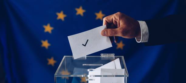 istock Man inserting his vote to ballot box. 1150887362
