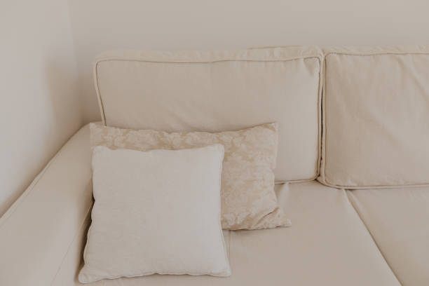 istock beige sofa with pillows in living room - Image 1150889413