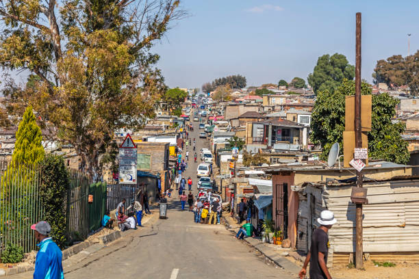 Alexandra Township with a street view panorama, Johannesburg Alexandra Township with a street view panorama, Johannesburg. Alexandra also known as Alex was developed since 1912 and allocated for the africans in the apartheid era, it is now home to over 400 000 inhabitants in an area 7,6 km2, and forms part of Johannesburg city council. alexandra township photos stock pictures, royalty-free photos & images