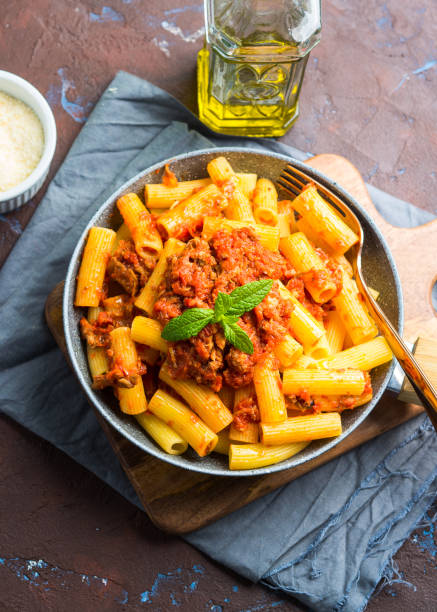 istock Delicious rigatoni pasta with tomato meat ragu 1150891288