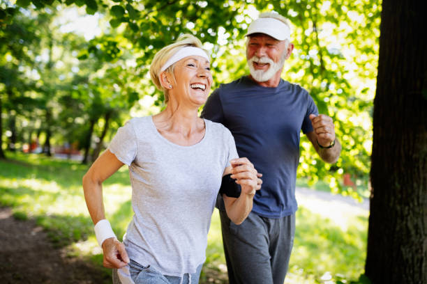 istock Mature couple jogging and running outdoors in nature 1150892309