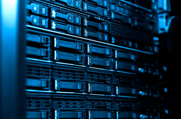 istock Close up blade server equipment rack in big data center with blurred side frame cold blue tone 1150892685
