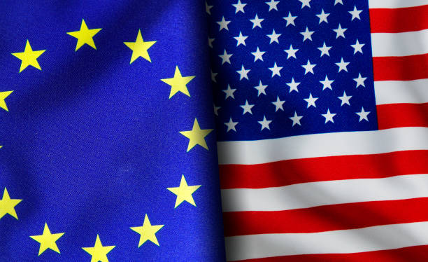 istock American and European union flags standing side by side 1150894587