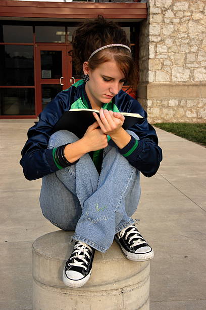 istock female teen student bible study 115089465