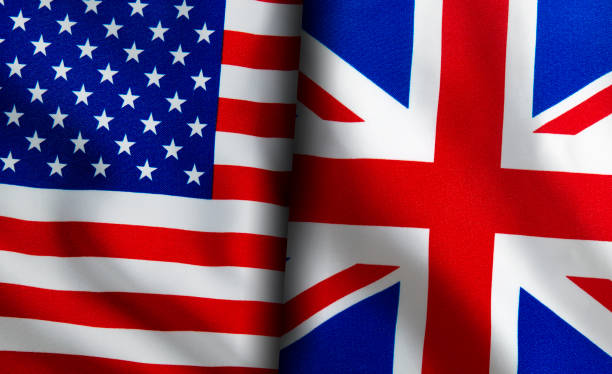 istock American and English flags standing side by side 1150895032