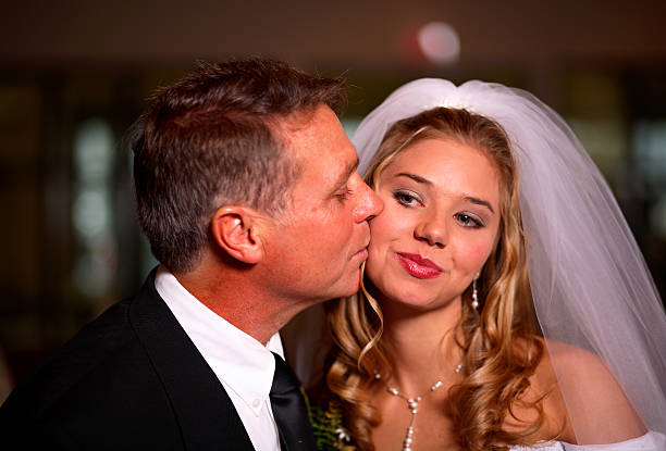 istock wedding portraits - bride and father 115089833