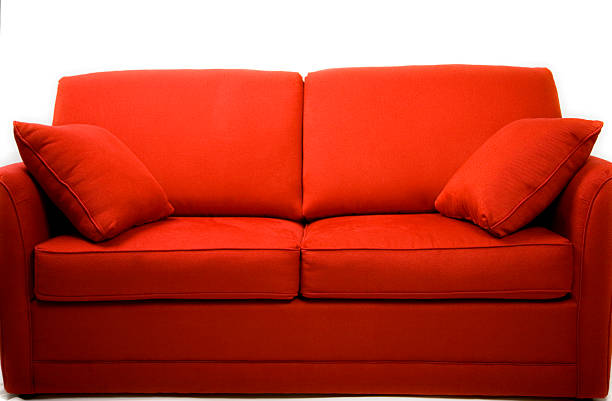 red couch love seat stock photo