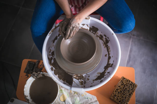 istock Close up of hands working on pottery wheel 1150899218