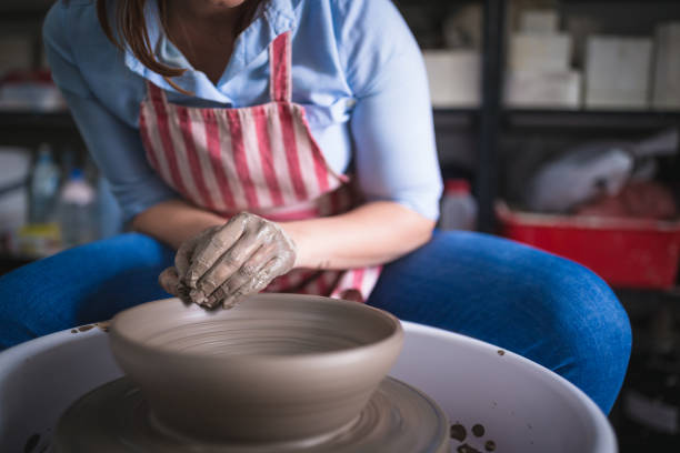istock Close up of hands working on pottery wheel 1150899238
