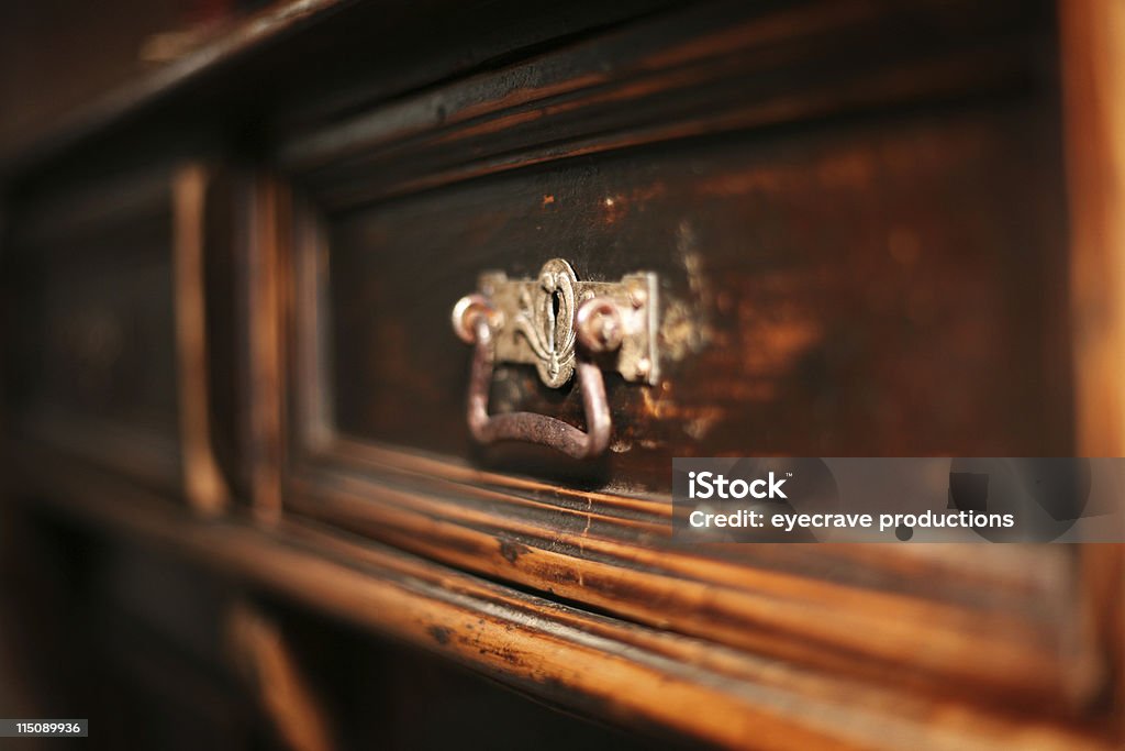 interior decor - antique drawer antique hand made vintage wooden hutch drawer - shallow depth of field and focus on metal handle  Furniture Stock Photo