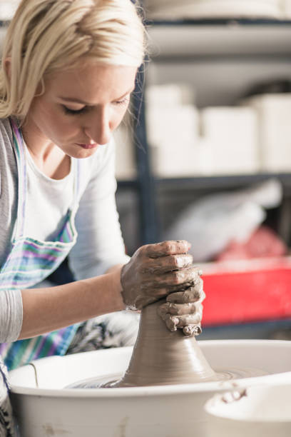 istock Pottery female artist 1150899419
