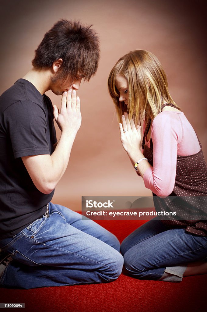 teenager young couple prayer portraits teenager young person scenes Activity Stock Photo