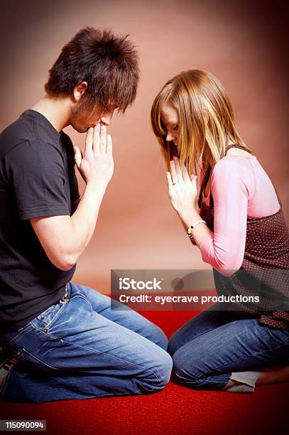 Teenager Young Couple Prayer Portraits Stock Photo - Download Image Now - Activity, Adolescence, Animal