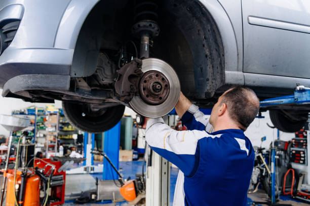 istock Man Repairing Car Tire 1150904467