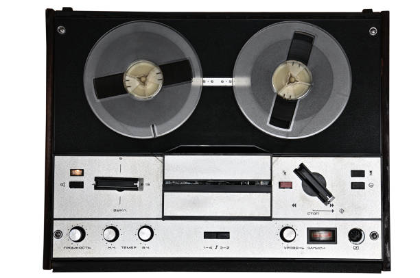 Vintage reel to reel tape recorder on white background.Retro tape recorder from the USSR Vintage reel to reel tape recorder on isolated white background. Retro tape recorder from the Soviet Union reel to reel tape stock pictures, royalty-free photos & images