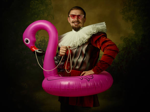 istock Young man as a medieval knight on dark background 1150907405