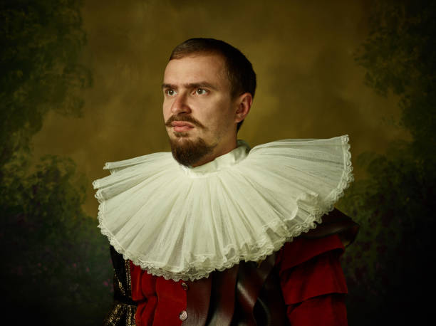 istock Young man as a medieval knight on dark background 1150907413