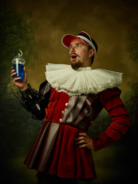istock Young man as a medieval knight on dark background 1150907415