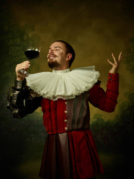 istock Young man as a medieval knight on dark background 1150907420