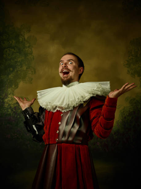 istock Young man as a medieval knight on dark background 1150907421