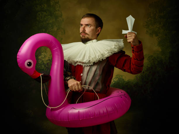 istock Young man as a medieval knight on dark background 1150907427