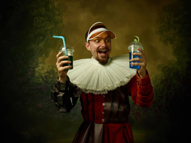 istock Young man as a medieval knight on dark background 1150907446